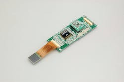 FIGURE 4. Shown here is an MPPC module that makes use of the monolithic 4 × 4-channel array on flex cable. The electronics include a high-voltage power supply, temperature compensation circuit, and two ASICs mentioned in the text. FIGURE 4. Shown here is an MPPC module that makes use of the monolithic 4 × 4-channel array on flex cable. The electronics include a high-voltage power supply, temperature compensation circuit, and two ASICs mentioned in the text.