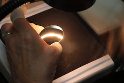 FIGURE 4. Inspection of high-LIDT optics during process development and, later, in volume production is an integral part of the complete optics fabrication process. FIGURE 4. Inspection of high-LIDT optics during process development and, later, in volume production is an integral part of the complete optics fabrication process.