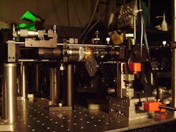 A microscope apparatus is being used at NIST to understand differences between near-resonance and far-from-resonance trapping and tweezing of particles. The study could improve the prospects for near-resonant trapping at lower power levels, to limit damage to biological specimens.