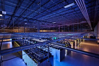 FRONTIS. An increasing amount of computing and data storage is migrating to a planetary cloud of warehouse-scale datacenters like this one.