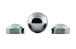 FIGURE 2. Plano-aspheric lenses of BD6 chalcogenide glass are reflected in a sphere of the same material. FIGURE 2. Plano-aspheric lenses of BD6 chalcogenide glass are reflected in a sphere of the same material.