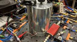 NIST’s ultrafast electro-optic laser relies on this aluminum cavity to stabilize and filter the electronic signals, which bounce back and forth inside until fixed waves emerge at the strongest frequencies and block or filter out other frequencies.