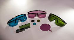 Examples of laser-safety eyewear for different laser wavelengths are shown next to some samples submitted for testing.