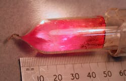 A pentacene-doped p-terphenyl crystal serves as the gain medium for a room-temperature solid-state maser. Here, the crystal boule is shown after doping, still sealed in the vial of borosilicate glass used to contain it during the doping procedure (a zone-refining operation that takes place in a furnace). A pentacene-doped p-terphenyl crystal serves as the gain medium for a room-temperature solid-state maser. Here, the crystal boule is shown after doping, still sealed in the vial of borosilicate glass used to contain it during the doping procedure (a zone-refining operation that takes place in a furnace).