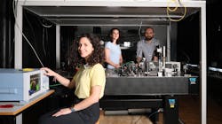 Eirini Tagkoudi, Camiile Brès, and Davide Grassani test their mid-IR supercontinuum light source. Eirini Tagkoudi, Camiile Brès, and Davide Grassani test their mid-IR supercontinuum light source.