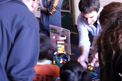USCF biomedical sciences grad student Michael Sachs demonstrates LegoScope to some kids at the Bay Area Science Festival.