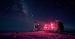 The 10-meter South Pole Telescope and the BICEP (Background Imaging of Cosmic Extragalactic Polarization) Telescope are shown against the Milky Way. BICEP2 recently detected gravitational waves in the cosmic microwave background, a discovery that supports the cosmic inflation theory of how the universe began.