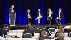 FIGURE 1. The Quantum Technologies Panel (left to right: Moderator John Dexheimer, Graeme Malcolm, Jamil Abo-Shaeer, Chris Monroe, and Tim Day) tried to answer questions such as the types of systems that vendors need from the photonics sector in terms of component specs/ technologies.