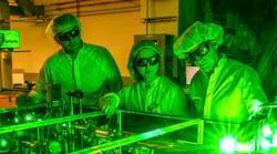 Berkeley Lab doctoral student Fumika Isono (center), BELLA Center Deputy Director Jeroen van Tilborg (right), and research scientist Sam Barber set up a novel laser stabilization experiment at one of the BELLA Center’s 100 TW-class lasers.