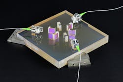 The Max Planck Institute AEI Hannover optical bench for test of LISA technology is seen before it was integrated in the vacuum chamber. The three lasers are transmitted via optical fibers. The Max Planck Institute AEI Hannover optical bench for test of LISA technology is seen before it was integrated in the vacuum chamber. The three lasers are transmitted via optical fibers.