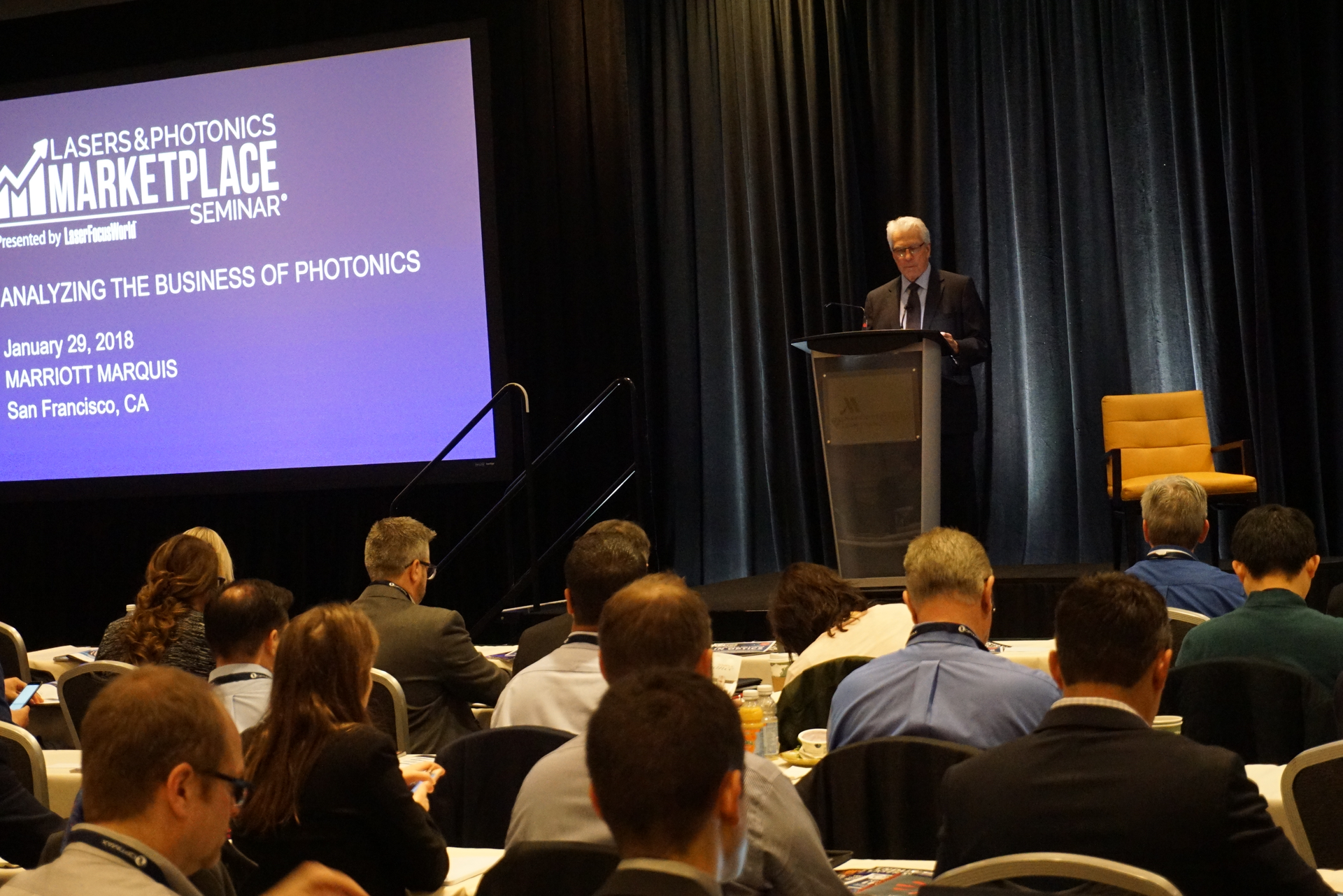 FIGURE 1. Conard Holton, Editor in Chief of Laser Focus World, kicks off the 30th Lasers & Photonics Marketplace Seminar, thanking sponsors and introducing the agenda for the day; the Seminar attracted a record number of attendees to take advantage of a banner time in lasers and photonics.