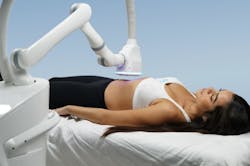 FIGURE 3. A laser treatment head coupled to a robotic arm, shown here in Dominion Aesthetic Technologies’ Eon system, allows a fully automated, noncontact protocol over a large area. FIGURE 3. A laser treatment head coupled to a robotic arm, shown here in Dominion Aesthetic Technologies’ Eon system, allows a fully automated, noncontact protocol over a large area.