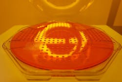 FIGURE 6. 200 mm photoresist master substrate for wafer-level optics carrying 250 Fresnel lenslets. FIGURE 6. 200 mm photoresist master substrate for wafer-level optics carrying 250 Fresnel lenslets.