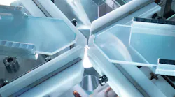 FIGURE 1. Two crossed optical resonators are located inside a vacuum chamber. Each resonator’s mirrors consist of the end faces of two opposing optical fibers. These fibers are barely visible as a cross of thin dark lines in the center of the image.