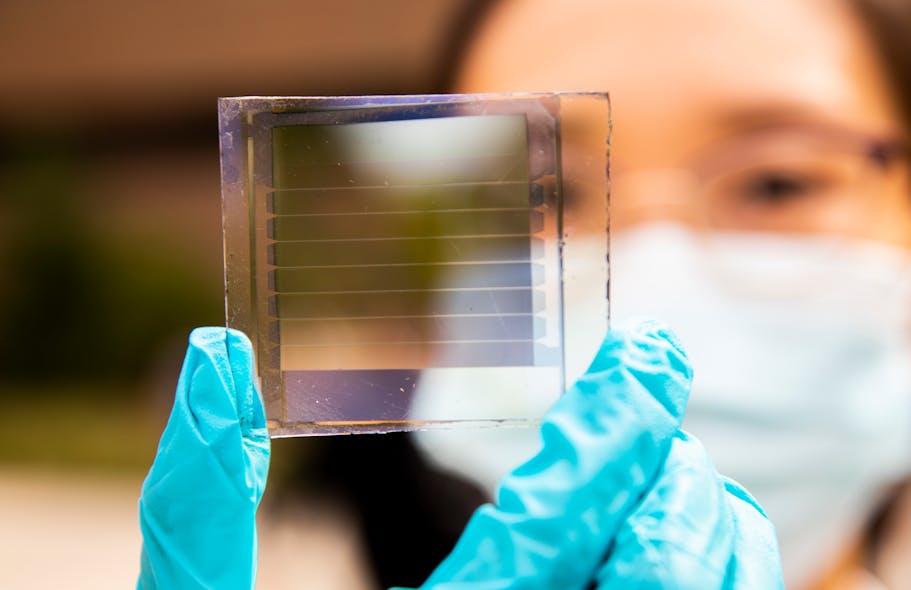 Xinjing Huang, a doctoral student in Forrest&rsquo;s lab, holds a 20% transparency, 30-year solar cell module that she built. The longevity of the design is a major step toward practical windows that provide solar power.