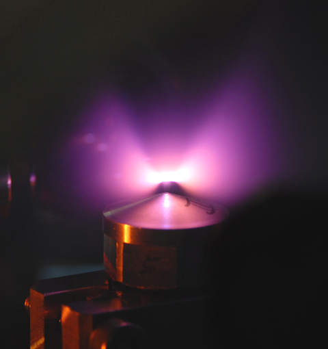 Helium atoms flowing from a small nozzle are ionized by a laser pulse, forming a plasma channel from helium ions and free electrons. In this channel, the flash of light accelerates a small portion of the electrons almost to the speed of light.