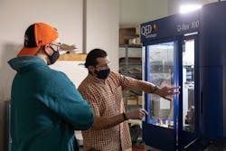SR lab technician and lecturer Mike Pomerantz instructs a student in the Optical Systems Technology program at Monroe Community College about operating the QED Q-flex 100 MRF polishing machine. SR lab technician and lecturer Mike Pomerantz instructs a student in the Optical Systems Technology program at Monroe Community College about operating the QED Q-flex 100 MRF polishing machine.