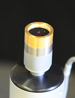 Close-up of a microphone, with the laser spot hitting the center of its diaphragm. Close-up of a microphone, with the laser spot hitting the center of its diaphragm.
