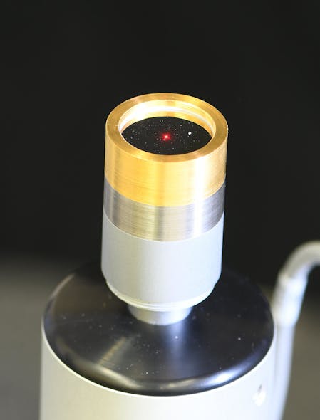 Close-up of a microphone, with the laser spot hitting the center of its diaphragm.