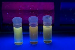 Vials of graphene quantum dots extracted from bituminous coal, anthracite, and coke show their fluorescence.