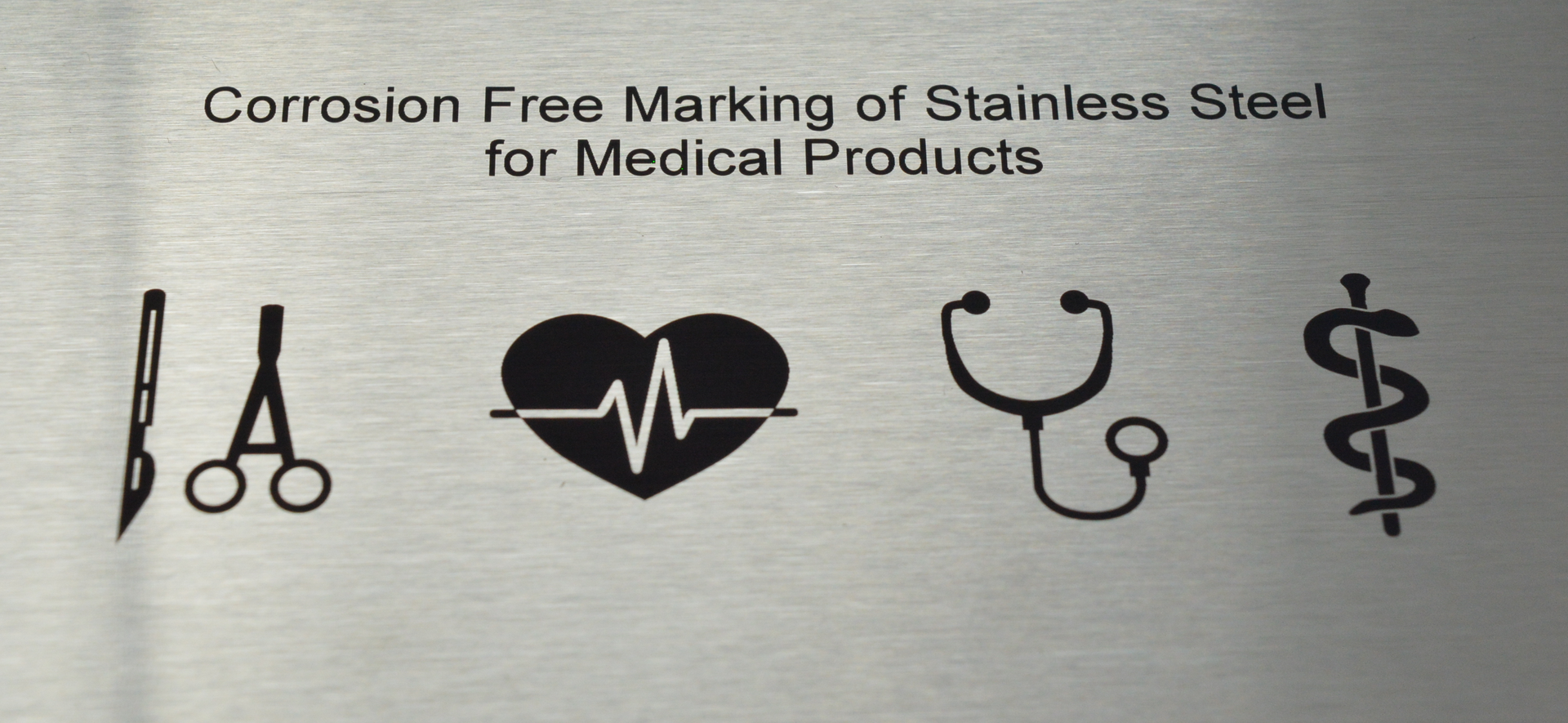 FIGURE 2. These black marks were created on 1.4301 stainless steel using a Coherent Rapid NX picosecond laser incorporated in a Rofin PowerLine marking subsystem.