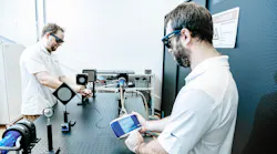 FIGURE 1. Measuring optical power output is key; shown here are laser technicians measuring that of a kilowatt-level fiber laser using Gentec-EO’s MAESTRO power and energy meter.