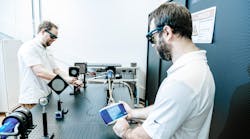 FIGURE 1. Measuring optical power output is key; shown here are laser technicians measuring that of a kilowatt-level fiber laser using Gentec-EO&rsquo;s MAESTRO power and energy meter.