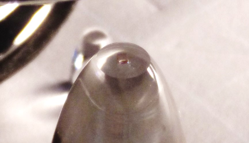 A diamond on a parabolic light collecting lens is the main component of the new angular rate sensor.