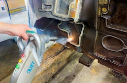 FIGURE 4. An application of rust removal with one of the 4JET’s portable laser cleaning systems. FIGURE 4. An application of rust removal with one of the 4JET’s portable laser cleaning systems.