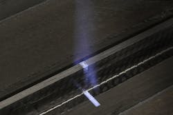 FIGURE 5. An example of pre-treatment of fiber-reinforced plastic (FRP) with a UV-excimer laser beam.
