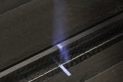 FIGURE 5. An example of pre-treatment of fiber-reinforced plastic (FRP) with a UV-excimer laser beam. FIGURE 5. An example of pre-treatment of fiber-reinforced plastic (FRP) with a UV-excimer laser beam.