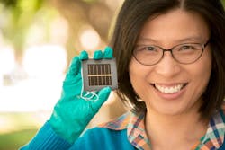 Anita Ho-Baillie, a senior research fellow at the Australian Centre for Advanced Photovoltaics at UNSW, holds the new perovskite cell.