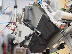FIGURE 2. A Coriolis C-solo robot arm with the Cailabs fiber placement head (shown at left).