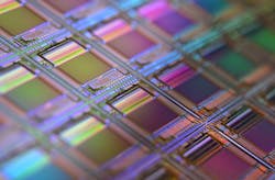 FIGURE 1. On a silicon wafer, each square is a chip with microscopic transistors and circuits. Ordinarily, wafers like these are diced into their individual chips and the chips go into the processors that power our smart technology devices. FIGURE 1. On a silicon wafer, each square is a chip with microscopic transistors and circuits. Ordinarily, wafers like these are diced into their individual chips and the chips go into the processors that power our smart technology devices.