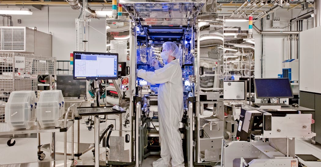 A Researcher At A Thermal Compression Bonding (tcb) Tool In Nano Fab South At Albany