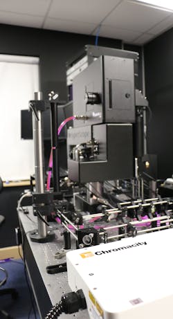FIGURE 1. A ytterbium fiber-based laser integrated with a multiphoton imaging setup creates a spatial light modulator system capable of interrogating larger neural networks at a higher resolution.