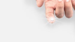 FIGURE 4. Single laser-driven Li-Fi module showing light spreading out to distribute signals through a room. FIGURE 4. Single laser-driven Li-Fi module showing light spreading out to distribute signals through a room.