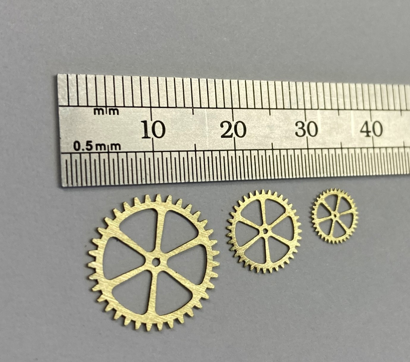 FIGURE 2. Erosion-cut micro gears from 0.35 mm brass.