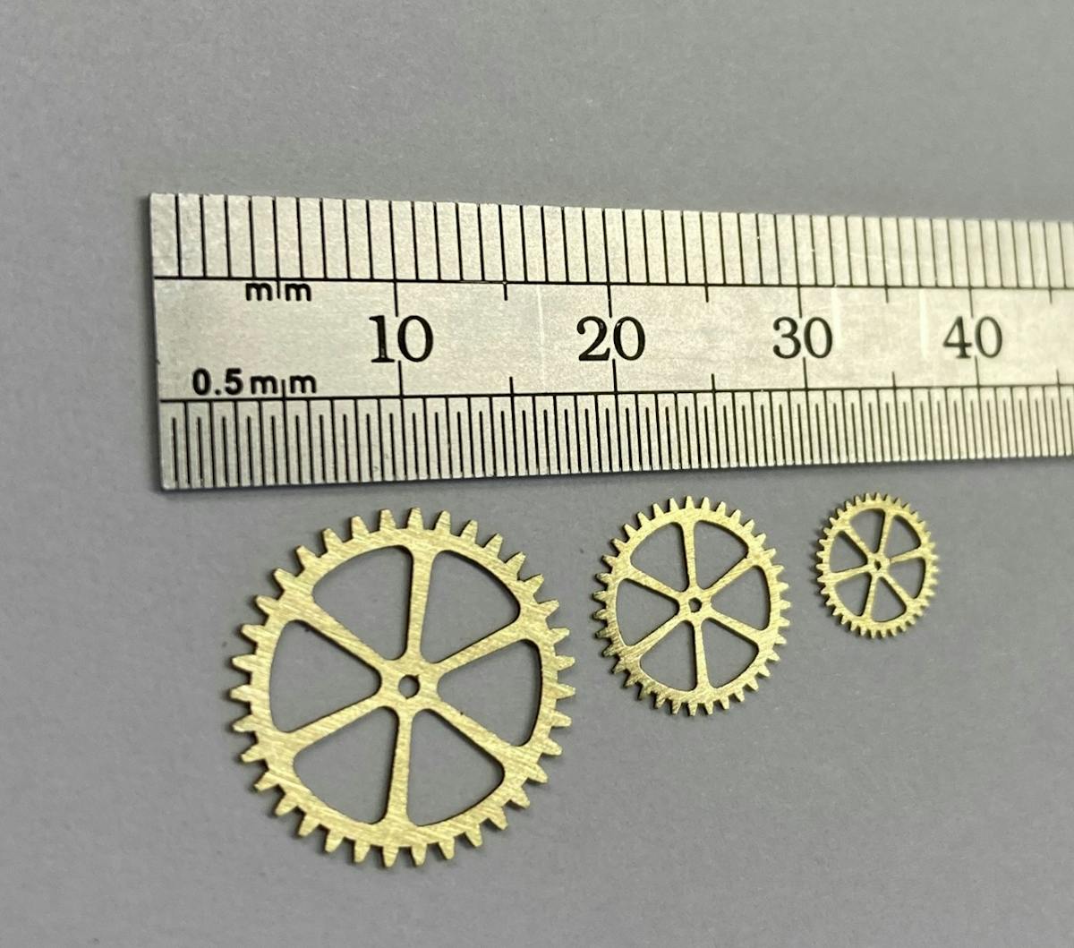 FIGURE 2. Erosion-cut micro gears from 0.35 mm brass.