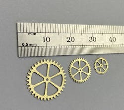 FIGURE 2. Erosion-cut micro gears from 0.35 mm brass. FIGURE 2. Erosion-cut micro gears from 0.35 mm brass.