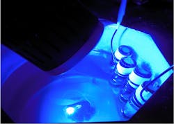 Reaction vials being exposed to LED blue light. Reaction vials being exposed to LED blue light.
