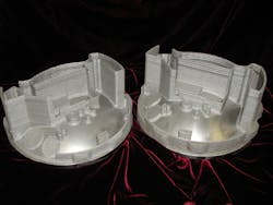 FIGURE 4. A metal satellite housing built with the hybrid process is shown; the base was machined from billet stock and thin wall structures were added with the LENS DED process. FIGURE 4. A metal satellite housing built with the hybrid process is shown; the base was machined from billet stock and thin wall structures were added with the LENS DED process.