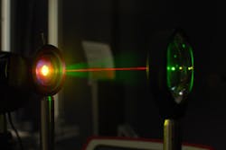 A laser beam is used in the lab to test the gold-hyperdoped sample of silicon to confirm its infrared-sensitive properties. A laser beam is used in the lab to test the gold-hyperdoped sample of silicon to confirm its infrared-sensitive properties.