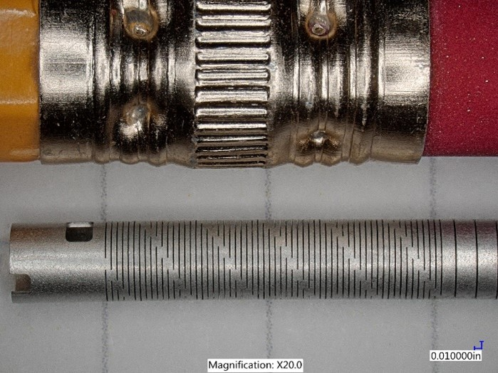 FIGURE 3. This flexible stainless steel delivery tube (shown next to a pencil eraser) has been cut with a Monaco femtosecond laser.