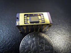 An integrated-optics chip (at center of chip package) contains hundreds of Stanford single-mode quantum-dot LEDs.
