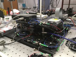 This is the optical setup of a new analog photonic correlator that can locate objects transmitting a radio signal. This is the optical setup of a new analog photonic correlator that can locate objects transmitting a radio signal.