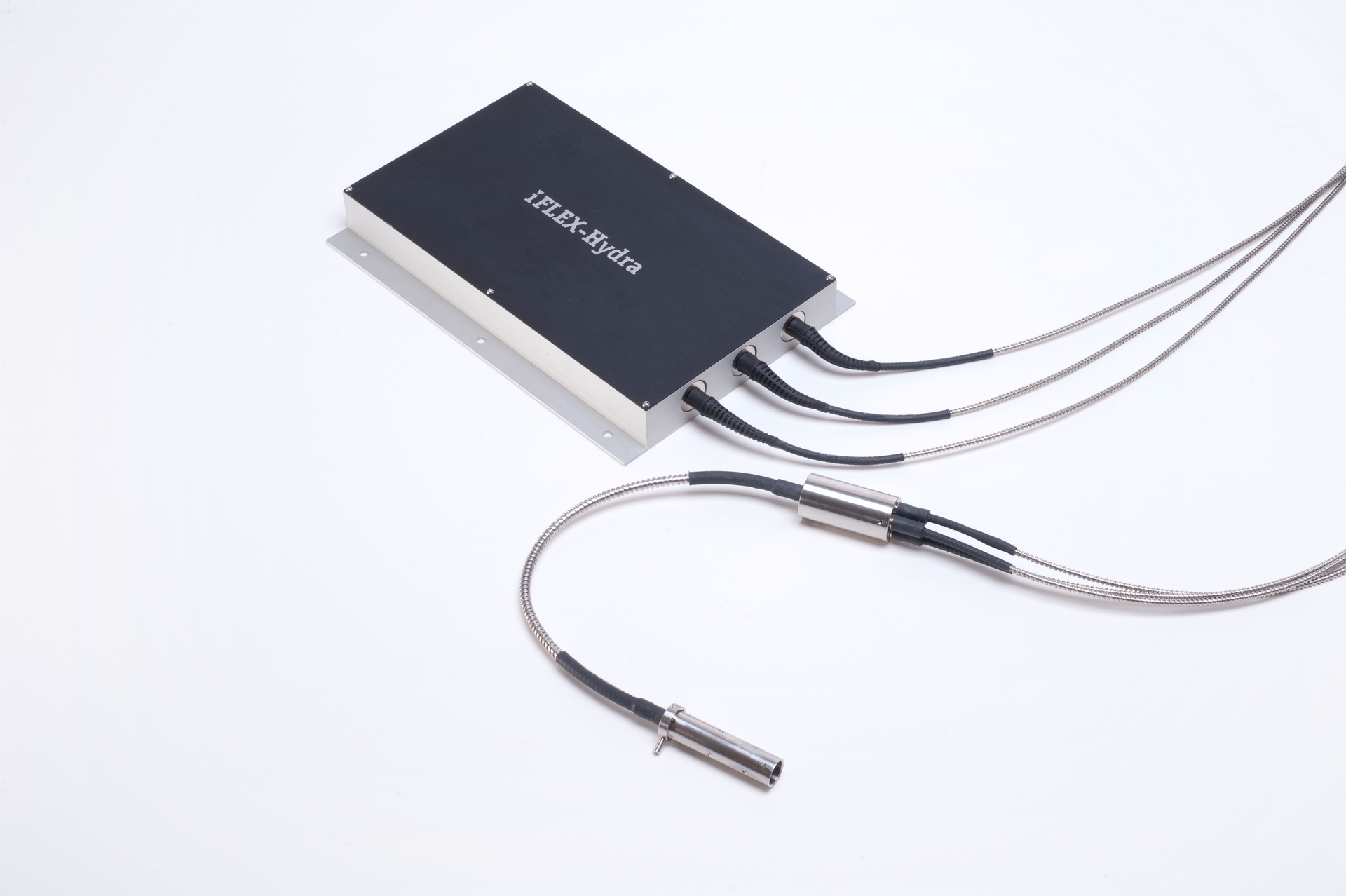 FIGURE 3. A three-line kineFLEX-Hydra attached to a combined three-laser module to form a complete multiline laser system where each line is delivered on a separate singlemode and polarization-axes-aligned fiber channel. In this instance, the fibers are permanently attached to the multiline laser system to achieve the smallest possible package size within a custom instrument format.