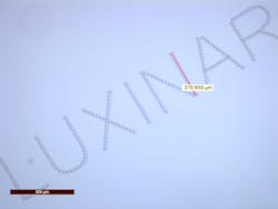 FIGURE 1. Subsurface marking in glass, with characters less than 0.5 mm high, is possible with femtosecond laser sources. FIGURE 1. Subsurface marking in glass, with characters less than 0.5 mm high, is possible with femtosecond laser sources.