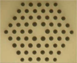 FIGURE 1. A single-mode microstructured polymer optical fiber (mPOF) has a core with a diameter of about 6 µm and a loss less than 1 dB/m at a 650 nm wavelength. FIGURE 1. A single-mode microstructured polymer optical fiber (mPOF) has a core with a diameter of about 6 µm and a loss less than 1 dB/m at a 650 nm wavelength.