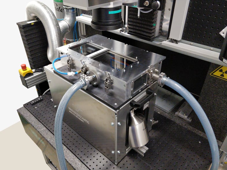 FIGURE 2. Custom-built powder bed integrated into a multi-laser machining station for additive and subtractive laser processing.